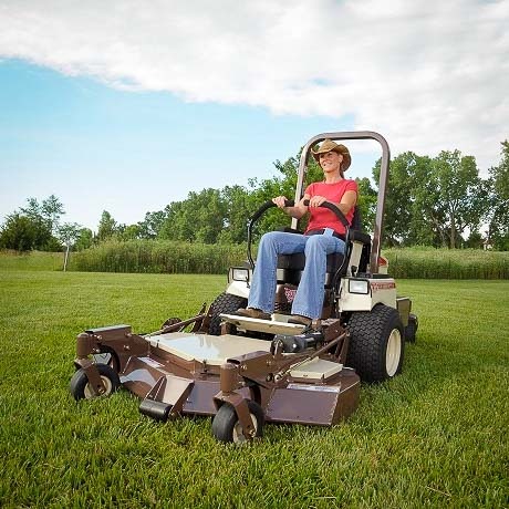 Lady on a Grasshopper zero turn mower